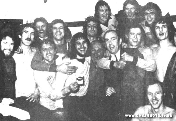 Jubilant Wanderers players and staff after the FA Cup replay success at Bournemouth 18 December 1974 - Left to right - Dave Alexandra, Dylan Evans, Dave Bullock, Tony Horseman, John Maskell, Gary Hand, Keith Searle, Jock Shepherd, Micky Holifield, Brian Lee, Graham MacKenzie, Howard Kennedy, Steve Perrin, Alan Phillips, Paul Birdseye - picture from Bucks Free Press
