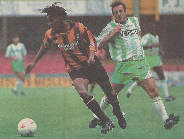 Wycombe's Simon Garner and Bradford's Richard Liburd in action at Valley Parade