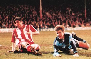 Steve McGavin sees his first half header hit the post - Brentford v Wycombe