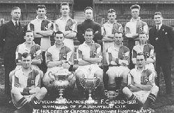 Wycombe Wanderers - Amateur Cup Winners 1931
Back: G.Harris (Trainer Coach), F.Rance, S.Crump, J.Kipping, R.Cox, J.Timberlake, R.Gardner (Sec)
Centre: C.Simmons, W.Brown, D.Vernon, F.Braisher, A.Britnell
Front: L.Badrick, A.Greenwell