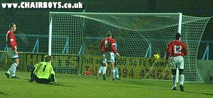 Gavin Holligan (hidden) sees his shot hit the back of the net to make it 3-0