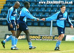 Damian Spencer thanks Kevin Charley after his second goal - Vinnie John  is the other player in shot