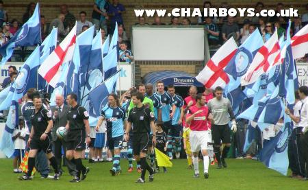 The teams enter the pitch prior to the match