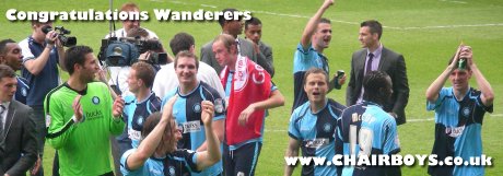 Wanderers players celebrate promotion after victory over Southend United