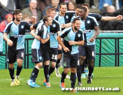 Wanderers players celebrate after Josh Scowen's opening goal