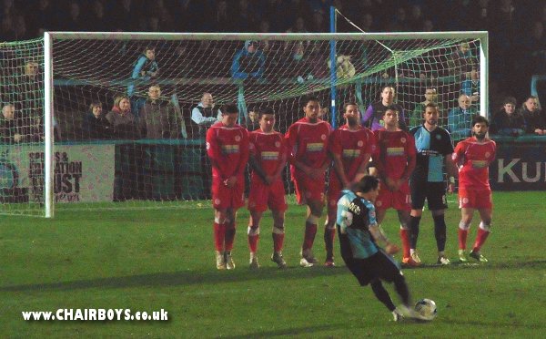 Sam Saunders about to see his free-kick strike the post