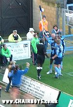 Craig Faulcolbridge and Dannie Bulman celebrate with Steve Brown after Wycombe's equaliser