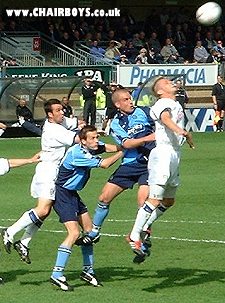 Roger Johnson and Andy Thomson battle for the ball against Colchester
