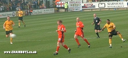 Tes Bramble swipes in the opening goal at The Abbey Stadium against Wycombe