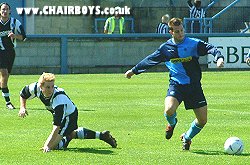 Joe Burnell about to see his shot blocked just before Matt Fox opened the scoring at Dorchester