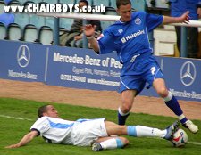 Danny Senda tackles former Wycombe player David Farrell