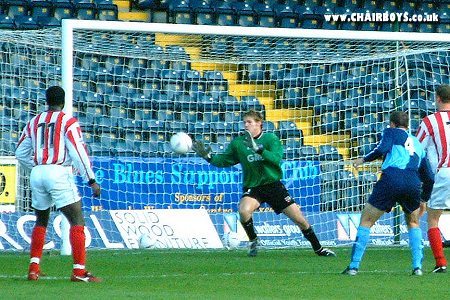 Triallist Scott Marshall about to see his header saved by Bees 'keeper Alan Julian