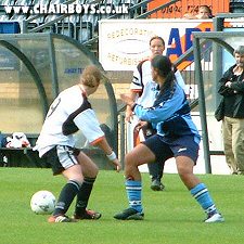 Jasmine Brown battles for the ball in midfield