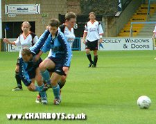 Marion Lyon and Esther Morley collide in a chase for the ball