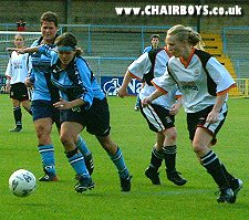 Debbie Richards breaks through with Karyn Atkinson looking on